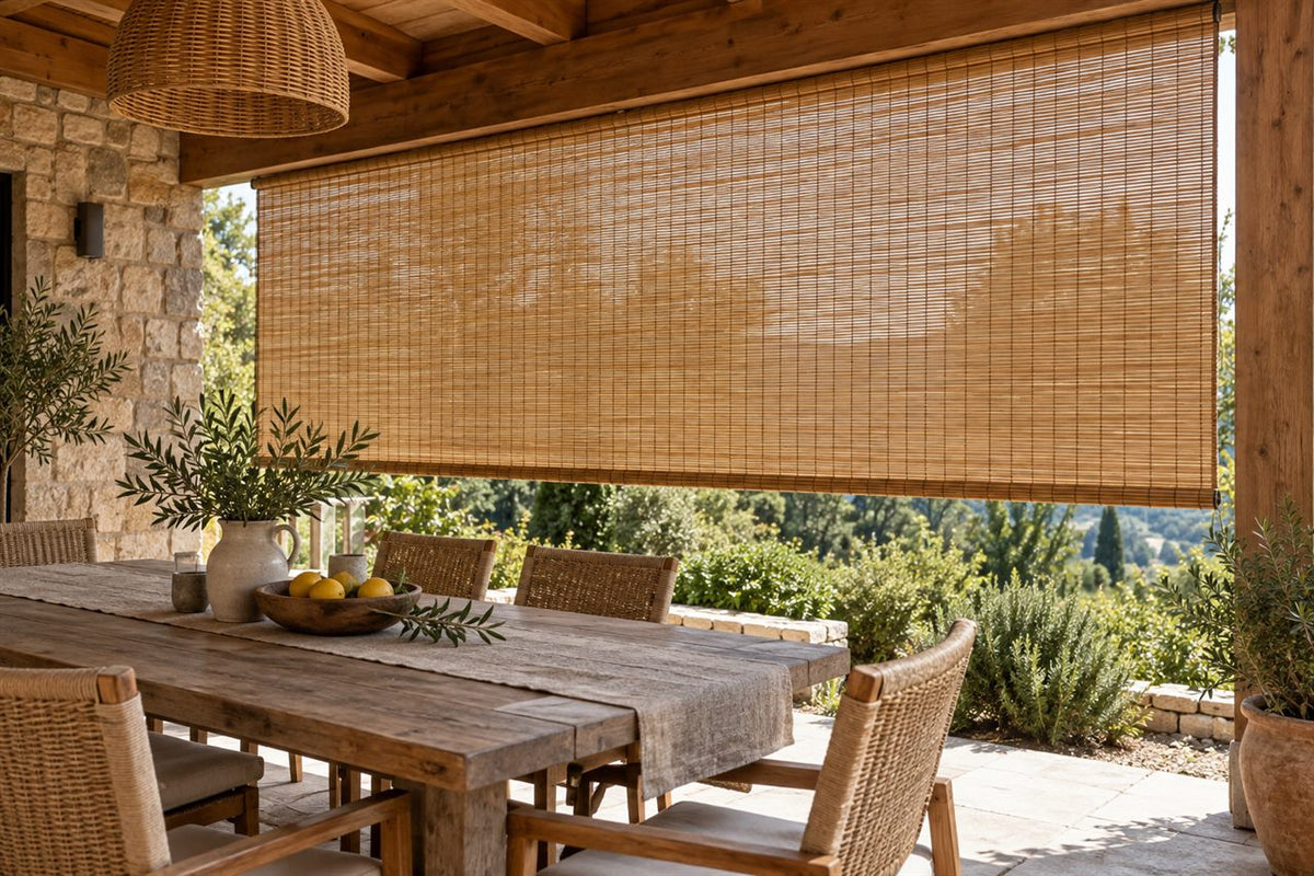 Covered patio with outdoor bamboo shades over a dining area