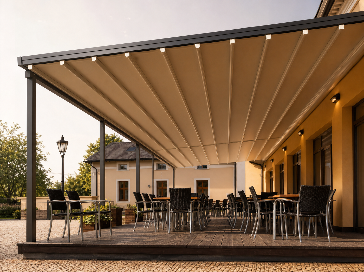 T700 motorized retractable folding canopy over a restaurant terrace