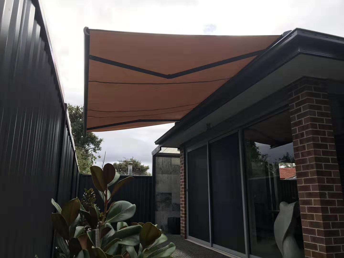 BESITSOL B04 box awning installed on a modern brick patio