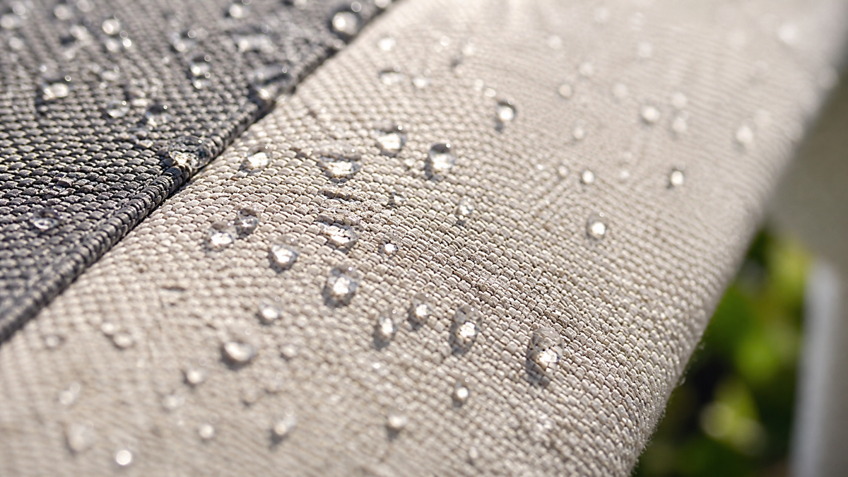 Water droplets beading on BESITSOL outdoor awning fabric