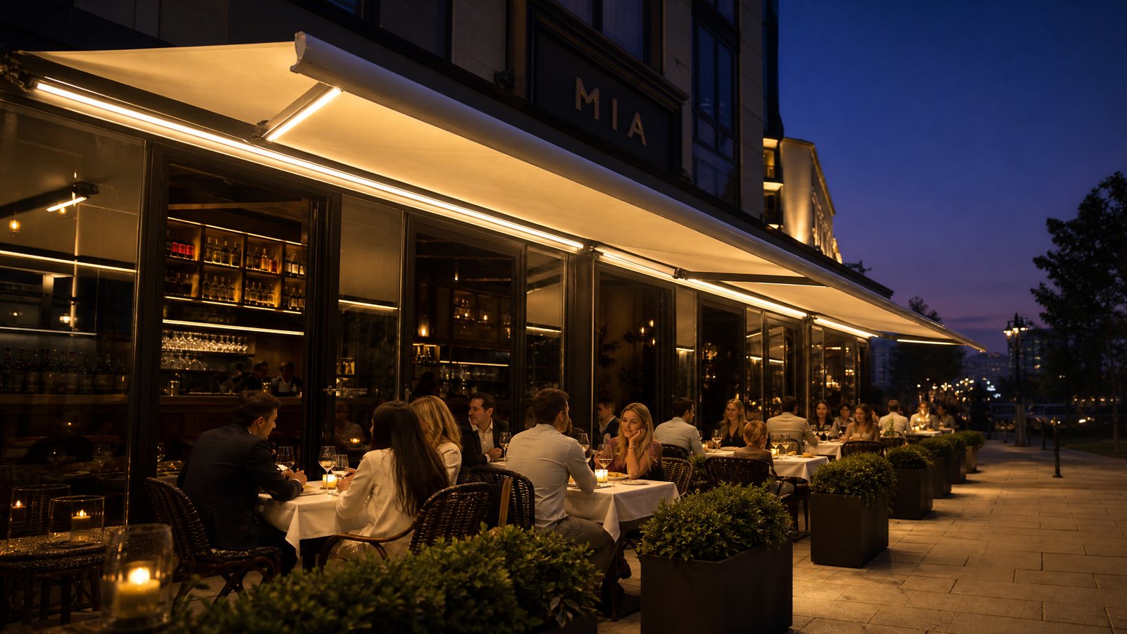 LED retractable awnings over a restaurant sidewalk dining area