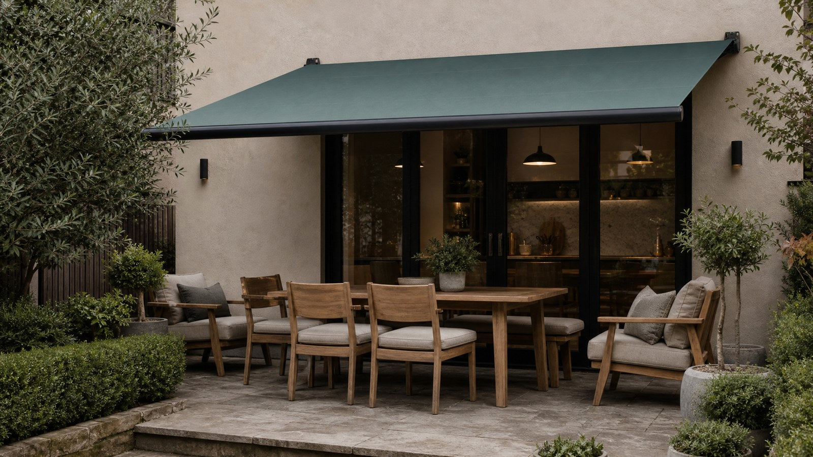 Wall-mounted retractable awning over a residential patio